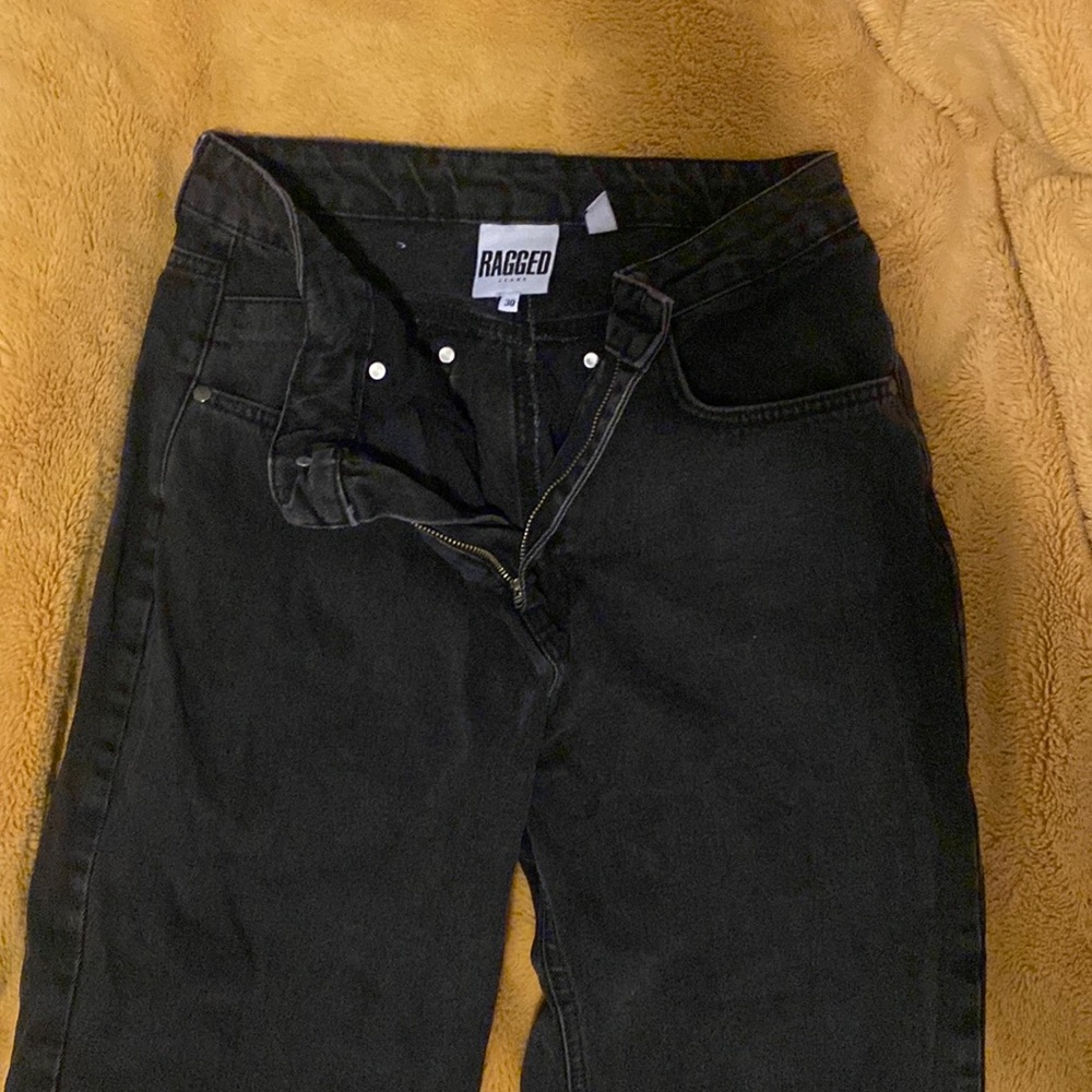 Ragged black jeans with butt cut out